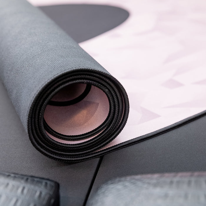 Roll of gray fabric on a white background