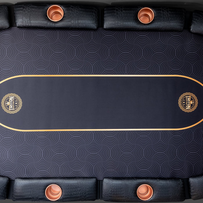 Black table with gold accents and circular cup holders on a dark background