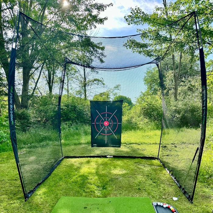 Golf practice net with a target in a grassy outdoor area