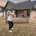 Person practicing golf swings in a home-built golf netting system.