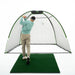 Person practicing golf swings inside a portable hitting cage on a green mat.