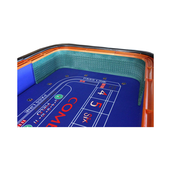 Close-up of a craps table with blue felt surface and orange border