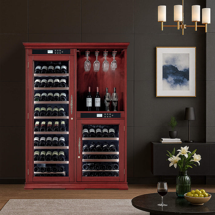 Red wine cabinet in a room with a dark wall, framed picture, and small table with a glass of wine and fruit bowl.