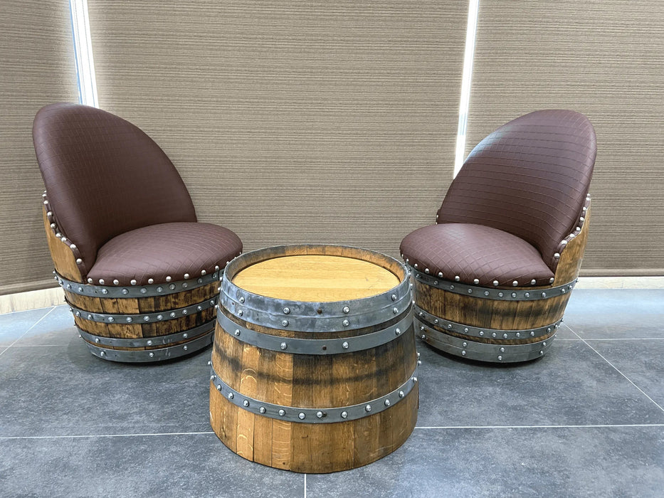 Two brown cushioned chairs with wooden barrel bases on a tiled floor.