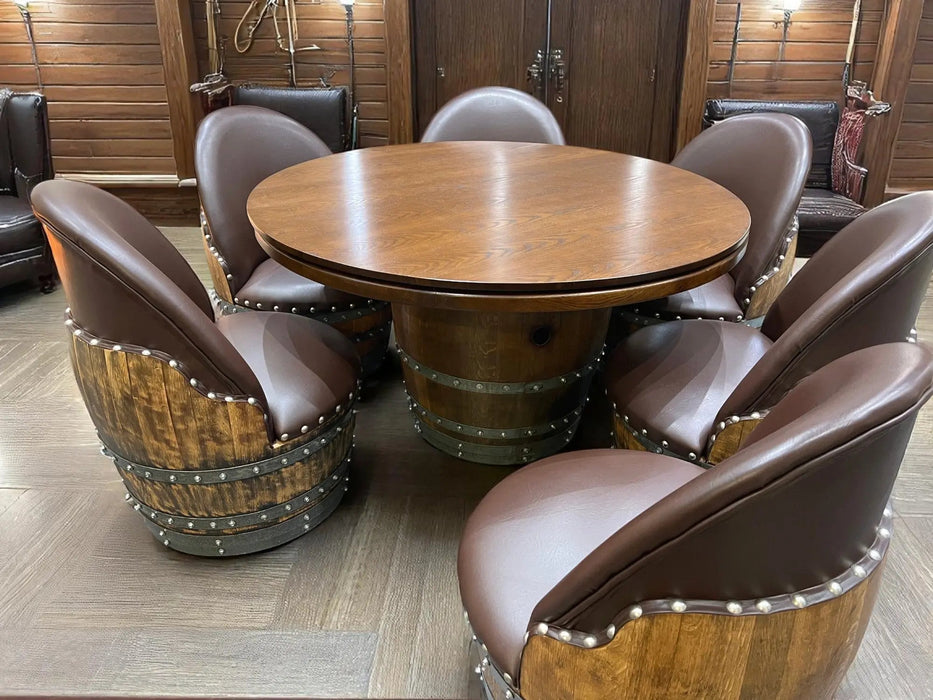 Wooden barrel-style table with matching chairs in a room with wooden walls.