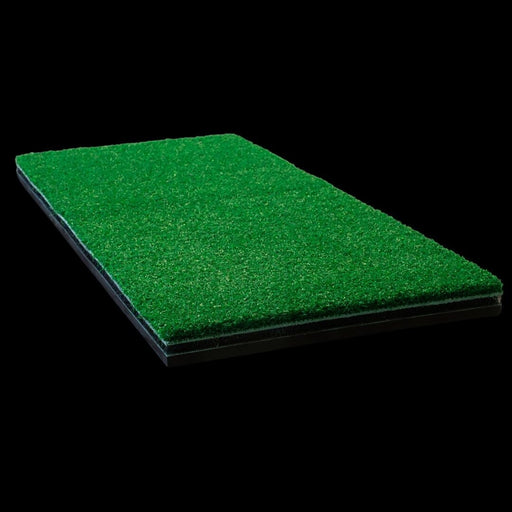 Green artificial grass mat on a black background