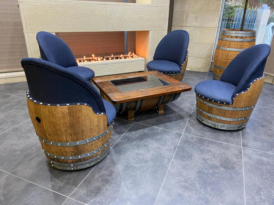 Wooden barrel chairs with blue cushions around a fire pit table.