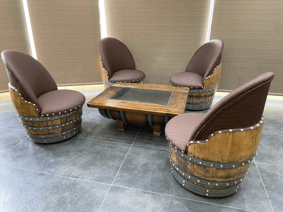 Wooden barrel chairs with a matching table on a tiled floor.