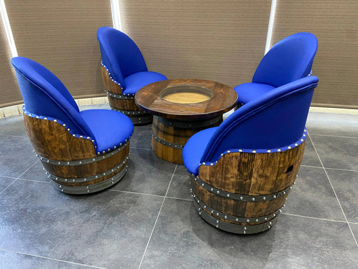 Three blue cushioned chairs and a wooden table on a tiled floor.