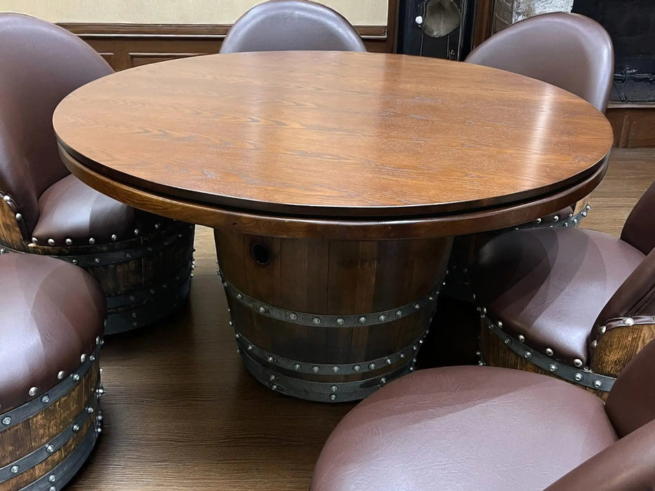 Wooden barrel-style table with round top and studded design, surrounded by matching chairs.