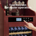 Wine cooler with digital display and touchscreen control panel, surrounded by wine bottles and glasses.