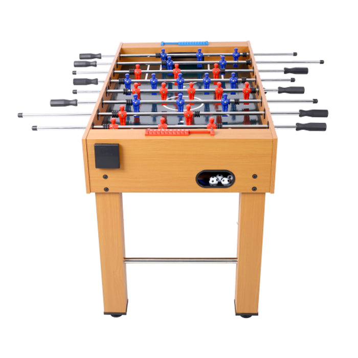 Foosball table with wooden finish and metal rods on a white background