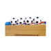 Four soccer-themed table tennis balls on a wooden table with blue and red edges.