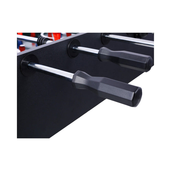 Close-up of a foosball table with black and silver rods on a white background