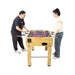 Two people playing table football on a white background