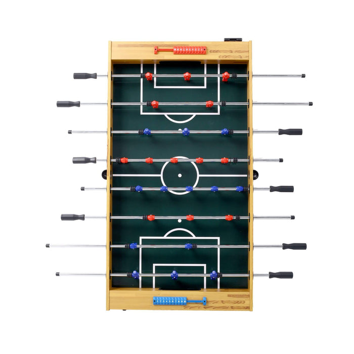 Foosball table with green playing surface and wooden frame on a white background