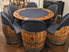 Wooden barrel-style chairs around a poker table with blue felt surface.
