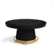 Black round coffee table with a gold metal base on a white background