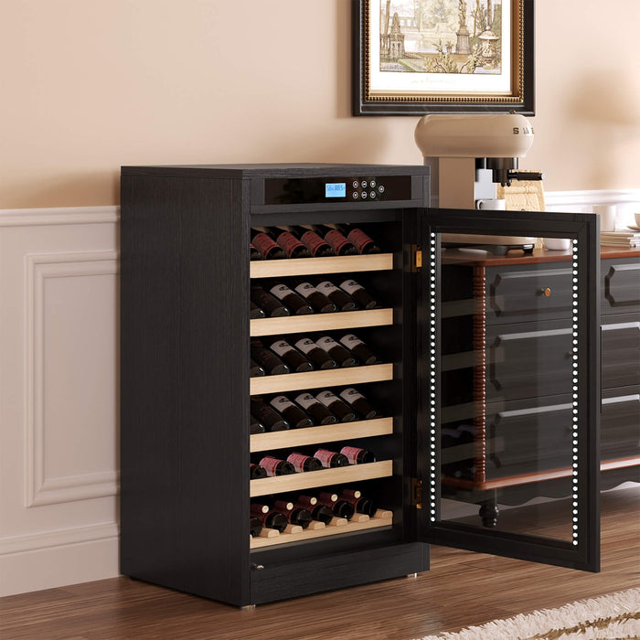 Black wine cooler with open door displaying wine bottles in a home setting.