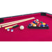 Pool table with pool balls, cues, and accessories on a red felt surface.