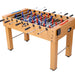 Foosball table with wooden surface and metal rods on a white background