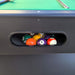 Pool balls in a billiard table pocket