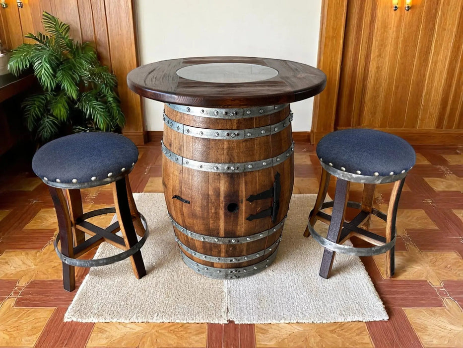 Wooden barrel table with two bar stools on a wooden floor.