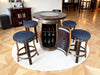 Bar setup with wooden barrel table and stools in a room.
