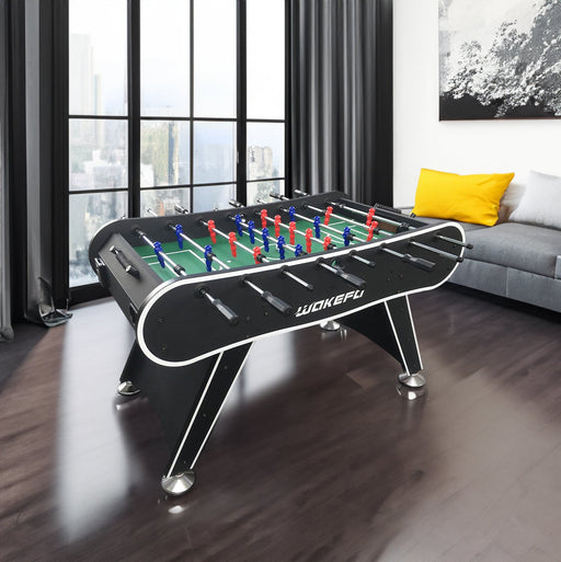 Foosball table with colorful figures in a modern living room.