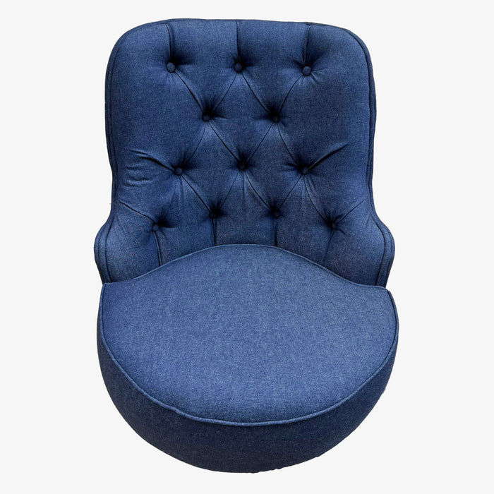 Blue tufted chair on a white background
