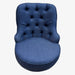 Blue tufted chair on a white background