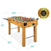 Foosball table with dimensions and safety certification label on a white background