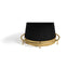 Black pleated lampshade on a gold metal stand against a white background