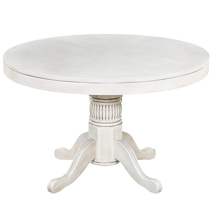 Round white table with a decorative pedestal base on a white background