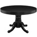 Black round table with decorative pedestal base on a white background