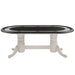 White dining table with a black glass top on a white background