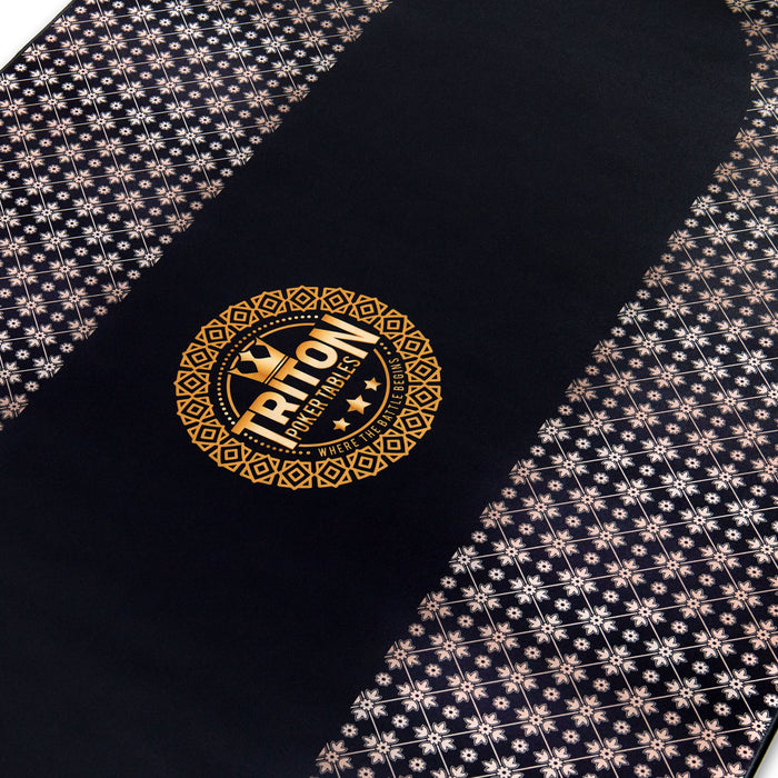Black poker table with gold Triton Poker logo and patterned edges