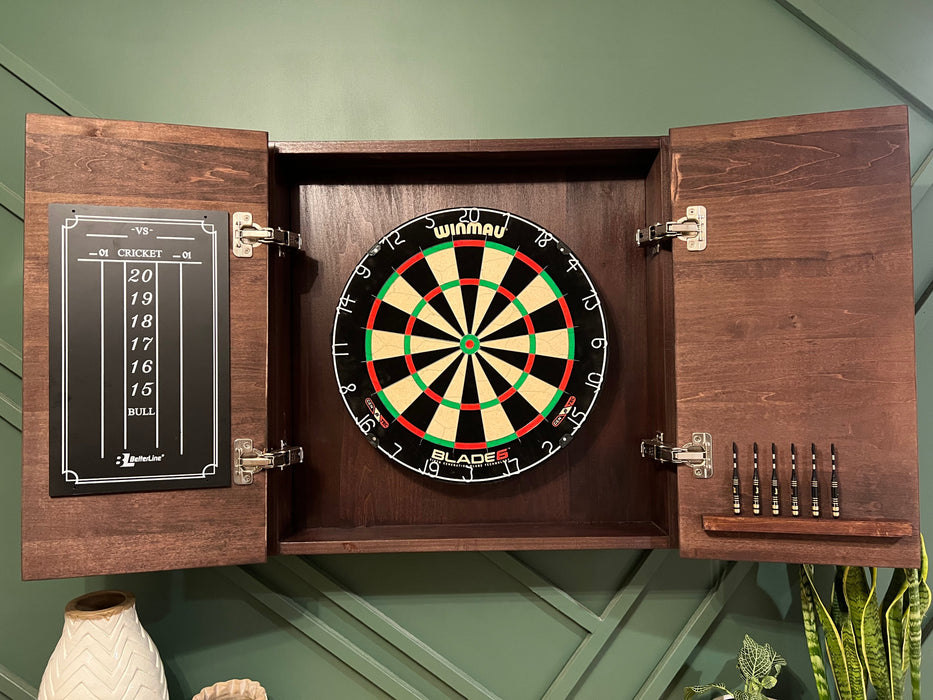 Dartboard with wooden cabinet and darts on a green wall background