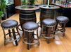 Bar setup with wooden barrel tables and stools in a bar setting