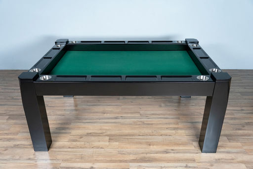 Green pool table with black frame on a wooden floor against a white wall