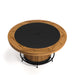 Round wooden table with a black top on a white background