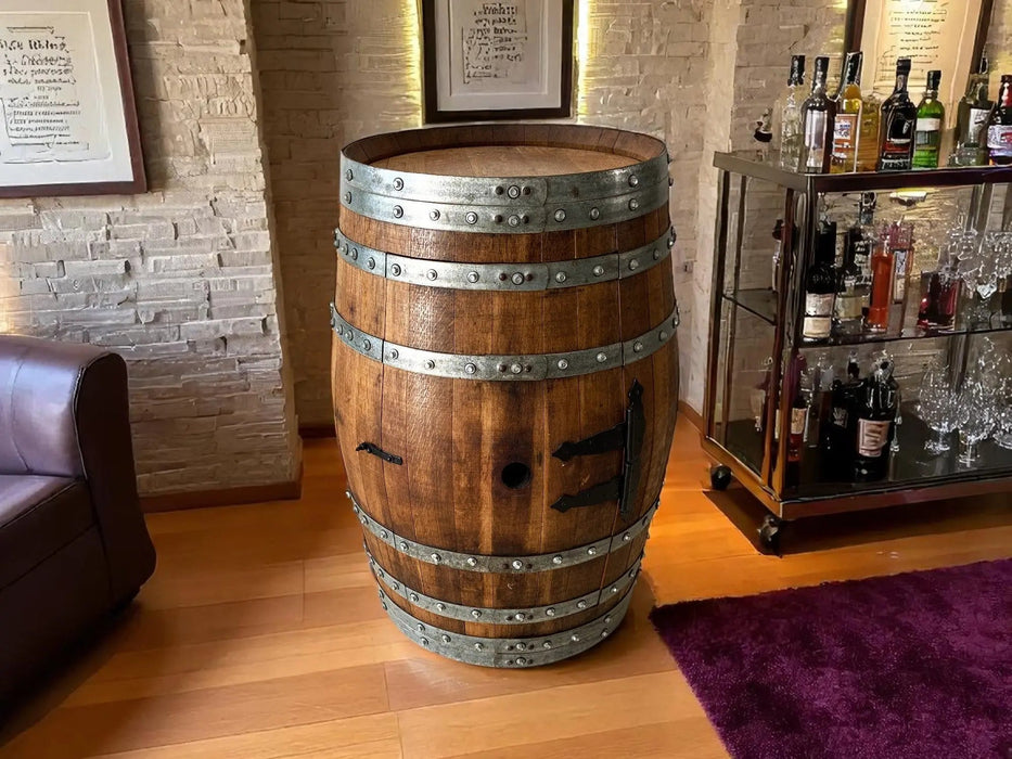 Wooden barrel with metal bands in a room with a bar setup.