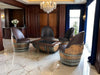 Luxurious room with barrel chairs and a chandelier