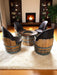 Wooden barrel chairs and table in a living room with a fireplace.