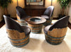 Wooden barrel chairs with a matching table in a room setting.