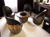 Wooden barrel chairs and table in a room setting