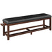 Long bench with black leather seat and wooden frame on a white background