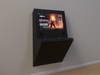 Black wall-mounted interactive display with a colorful screen on a plain wall.