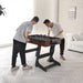 Two men playing foosball in a modern living room.