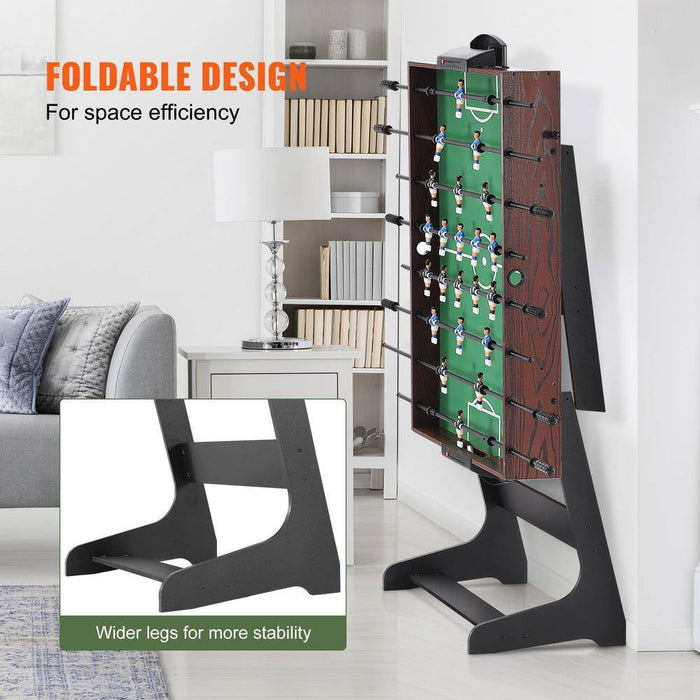 Foldable foosball table with wider legs for stability in a living room setting.